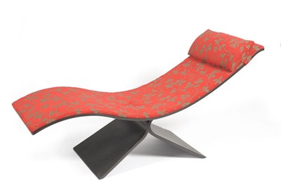 Lot 1762 - A Paso Doble Chaise, designed by Sergio Fahrer, eucalyptus frame with red fabric upholstery,...