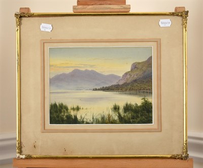 Lot 373 - Edward Horace Thompson (1879-1949)  Lake District view with house on a lake  Signed and dated 1927