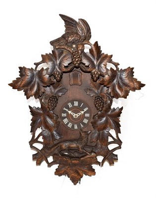Lot 480 - A Cuckoo Striking Wall Clock, 20th century, top carved pediment depicting birds, leaf and...
