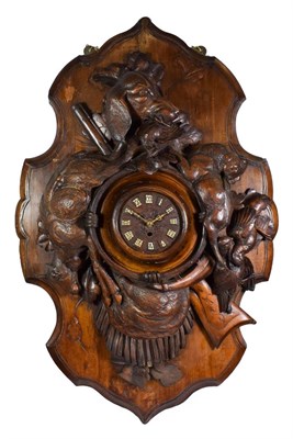Lot 482 - A Black Forest Carved Wooden Hunting Theme Wall Timepiece, circa 1890, carved case depicting a...