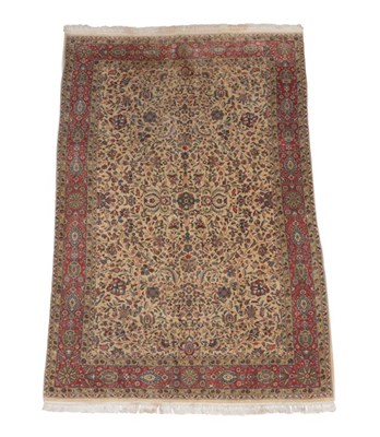 Lot 498 - Indian Carpet, modern The corn field with an allover design of palmettes and vines enclosed by...