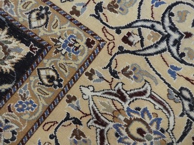 Lot 504 - Nain Part Silk Carpet Central Iran, circa 1970 the cream field of curvilinear vines around a flower