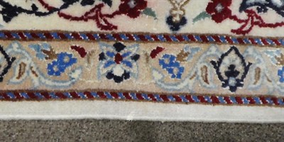 Lot 504 - Nain Part Silk Carpet Central Iran, circa 1970 the cream field of curvilinear vines around a flower