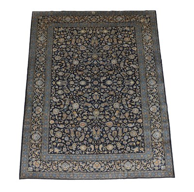 Lot 511 - Kashan Carpet Central Iran, circa 1970 the indigo field with an all over design of palmettes...