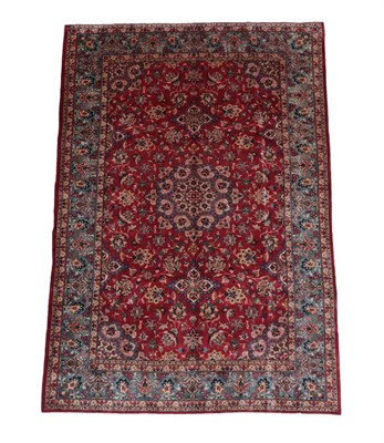 Lot 513 - Mashad Carpet North East Iran, circa 1970 The blood red field of vines around a flowerhead...