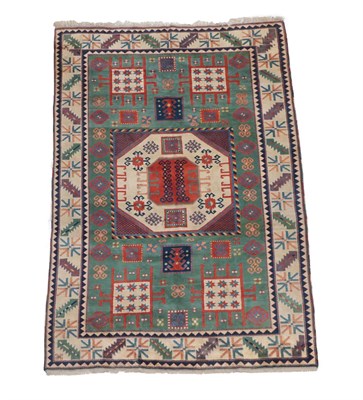 Lot 516 - Turkish Carpet of Karachov Kazak Design, modern The mint green field of tribal motifs around an...