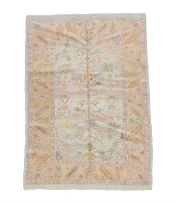 Lot 519 - Ushak Design Rug Central Anatolia, modern  the ivory field of angular vines and plants enclosed...