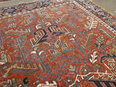 Lot 521 - Heriz Carpet Iranian Azerbaijan, circa 1920 The soft brick red field of large angular vines...