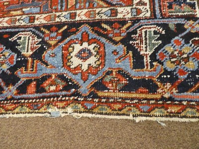 Lot 521 - Heriz Carpet Iranian Azerbaijan, circa 1920 The soft brick red field of large angular vines...