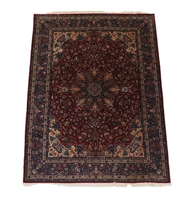 Lot 523 - Isfahan Part Silk Carpet Central Iran, circa 1970 The deep brick red field of scrolling vines...