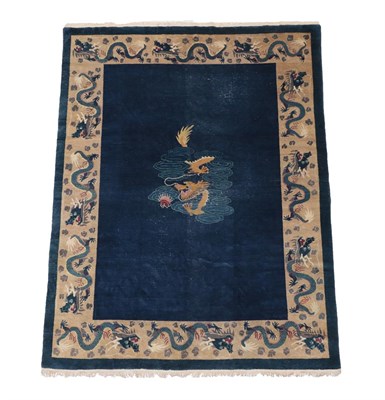 Lot 541 - Chinese Carpet, circa 1920 The deep indigo field with central panel containing a dragon enclosed by
