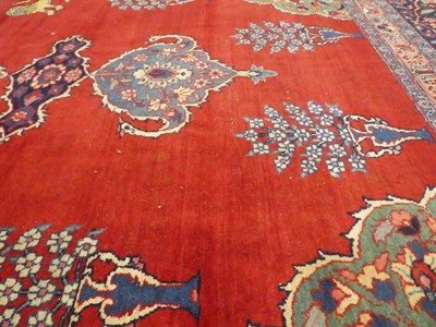 Lot 543 - Unusual Tabriz Carpet North West Iran, circa 1925 The abrashed blood red field with urns...
