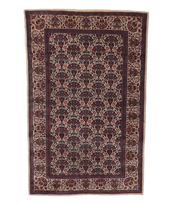 Lot 545 - Fine and Unusual Kashan Rug Central Iran, circa 1930 The ivory field with a oneway design of...