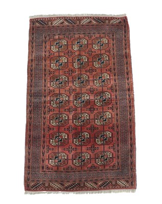 Lot 554 - Tekke Rug Probably Merve, circa 1920 The madder field with three rows of quartered güls...