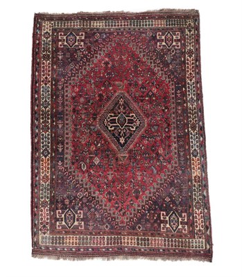 Lot 557 - Kashgai Rug South West Iran, circa 1960 The raspberry field of zoomorphic and tribal devices around