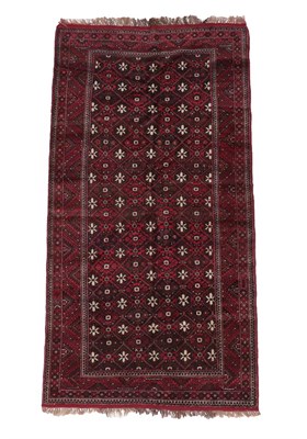Lot 558 - Baluch Rug Afghan/Iranian Frontier, circa 1950 The stepped diamond lattice field of flower...