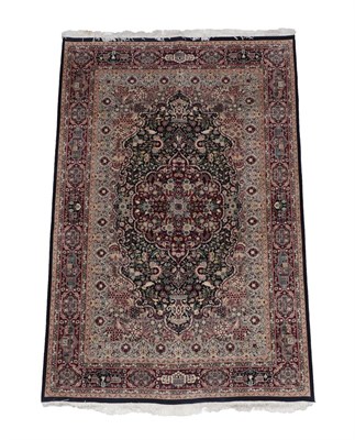 Lot 561 - Good Lahore Carpet, Punjab, modern The indigo field of vines around a cusped medallion framed...