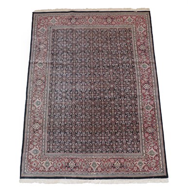 Lot 562 - Indian ''Feraghan'' Carpet, modern The indigo Herati field enclosed by terracotta orders of samovar
