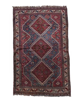 Lot 573 - Khamseh Rug South West Iran, circa 1910 The mid indigo field of tribal and zoomorphic motifs around