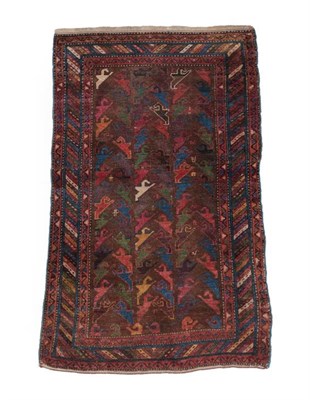 Lot 574 - Unusual Kurdish Rug West Iran, circa 1900 The chocolate brown field of polychrome hooked...