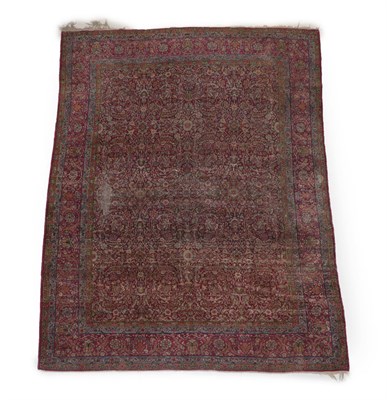 Lot 580 - Kirman Carpet South East Iran, circa 1930 The raspberry field with an all over design of...