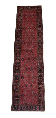 Lot 581 - Kurdish Runner  West Iran, circa 1940 The strawberry field with a oneway design of angular...