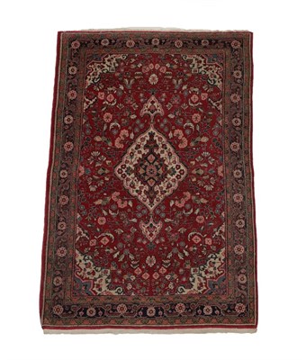 Lot 582 - Jozan Rug West Iran, circa 1970 The tomato red field of angular vines centred by a medallion framed