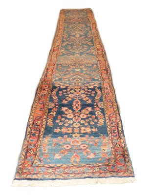 Lot 583 - Narrow West Persian Village Runner, circa 1930 The abrashed sky blue field with a single column...