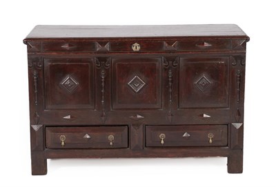 Lot 589 - A 17th Century Joined Oak Chest, the hinged lid enclosing a candle box above four moulded...