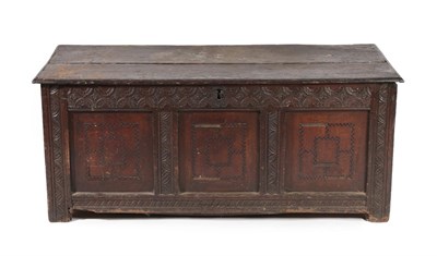 Lot 598 - A 17th Century Joined Oak Chest, the hinged lid above three parquetry decorated panels all...