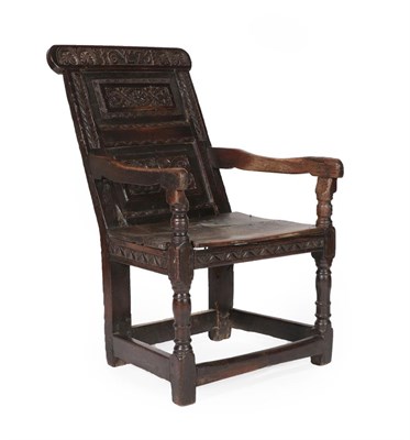 Lot 599 - A 17th Century Joined Oak Wainscot Armchair, dated 1675 and initialled LW, the carved top rail...
