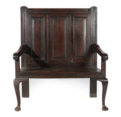 Lot 601 - A Joined Oak Two-Seater Settle, mid 18th century, the back support with three fielded panels...