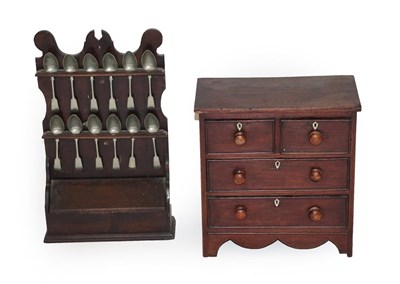Lot 602 - A Victorian Stained Pine Miniature Chest, of nailed construction, with two short over two long...