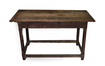 Lot 603 - An Early 18th Century Joined Oak Refectory Style Table, the three plank top with cleated ends and a