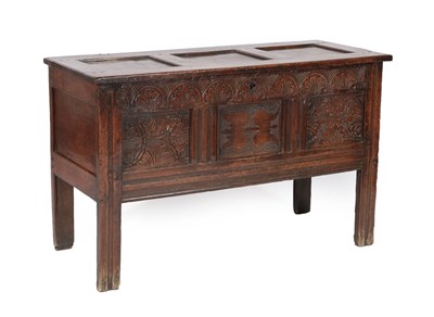 Lot 605 - An Early 18th Century Joined Oak Chest, the hinged lid with three moulded panels above a...