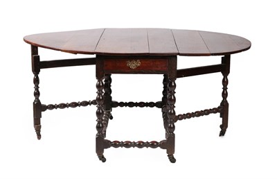 Lot 618 - A Joined Oak Six-to-Eight-Seater Gateleg Dining Table, circa 1720, with oval drop leaves above...