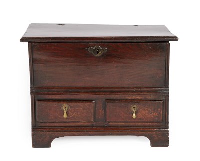 Lot 624 - An Early 18th Century Oak Chest, the hinged lid above two small drawers and an arched apron...