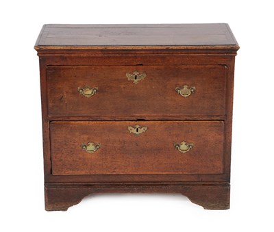 Lot 625 - An Oak Crossbanded and Pine Lined Chest, the moulded top over two deep drawers, on bracket...