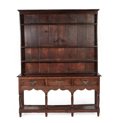 Lot 632 - A Late George III Open Dresser and Rack, early 19th century, the upper section with three fixed...