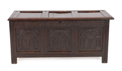 Lot 635 - A Late 17th Century Joined Oak Chest, the hinged lid with three moulded panels above a carved...