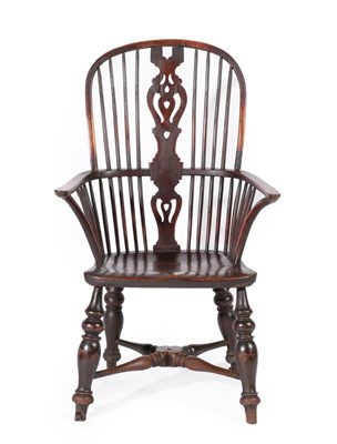 Lot 637 - A Mid 19th Century Yewwood and Elm Seated High-Back Windsor Armchair, with double spindle back...