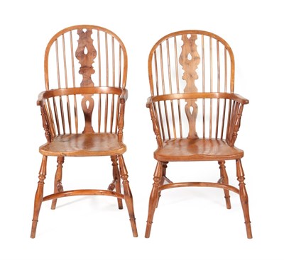 Lot 638 - A Matched Pair of 19th Century Yew Windsor Armchairs, with double row spindle back supports and...