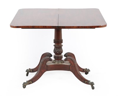 Lot 646 - A Regency mahogany foldover tea table, early 19th century, the hinged leaf above a gadrooned...