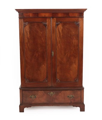 Lot 652 - A Late George III Mahogany Dwarf Linen Cupboard, early 19th century, the moulded dentil cornice...