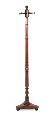 Lot 679 - A Mahogany Hat Stand, circa 1840, with spindle support and four turned arms in the form of pegs, on