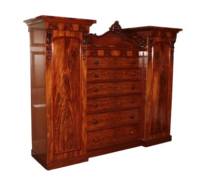 Lot 686 - An Early Victorian Mahogany Inverted Breakfront Wardrobe, circa 1860, with six long drawers flanked