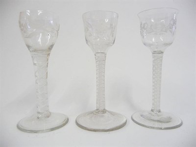 Lot 20 - A Wine Glass, circa 1765, the ogee bowl engraved with a flower and a bird on a double series opaque