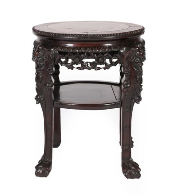 Lot 700 - A Chinese Padouk and Pink Marble Plant Stand, circa 1900, of circular form with foliate carved...