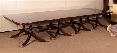 Lot 708 - ~ A Reproduction Mahogany Eight Pillar Dining Table, with two additional leaves, on conforming...