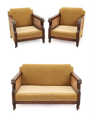 Lot 731 - An Early 20th Century Walnut Framed Double Caned Bergere Suite, upholstered in light green cut...